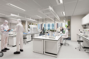 Medical researchers in white suits are working in a laboratory