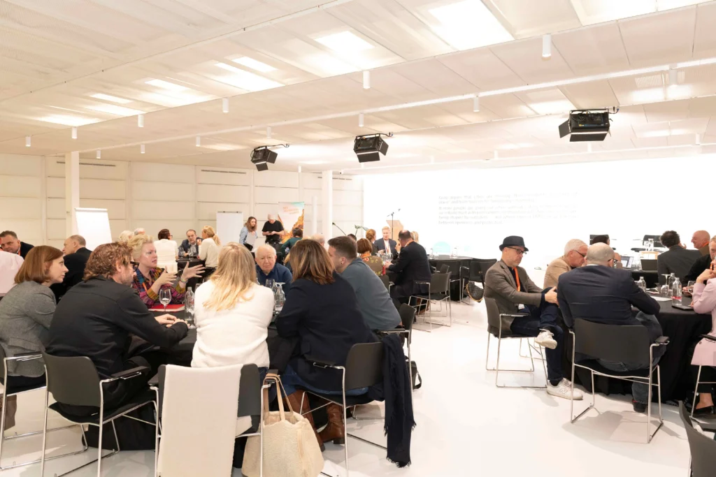 City DNA Barcelona conference, roundtables with attendees conversing