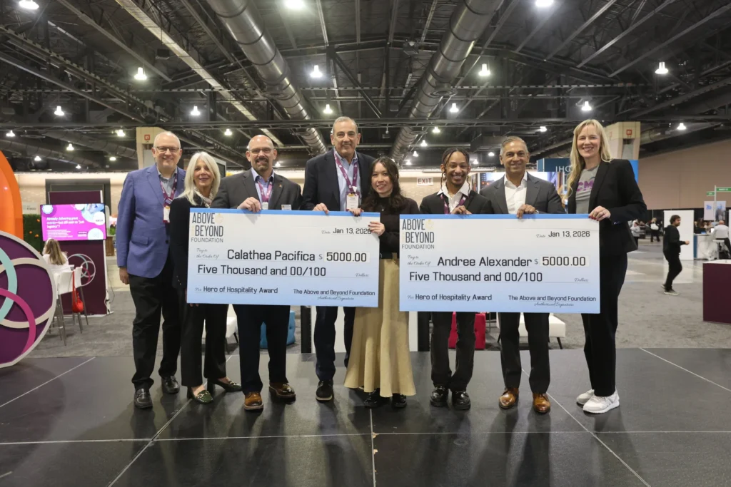 PCMA convening leaders holding giant cheques