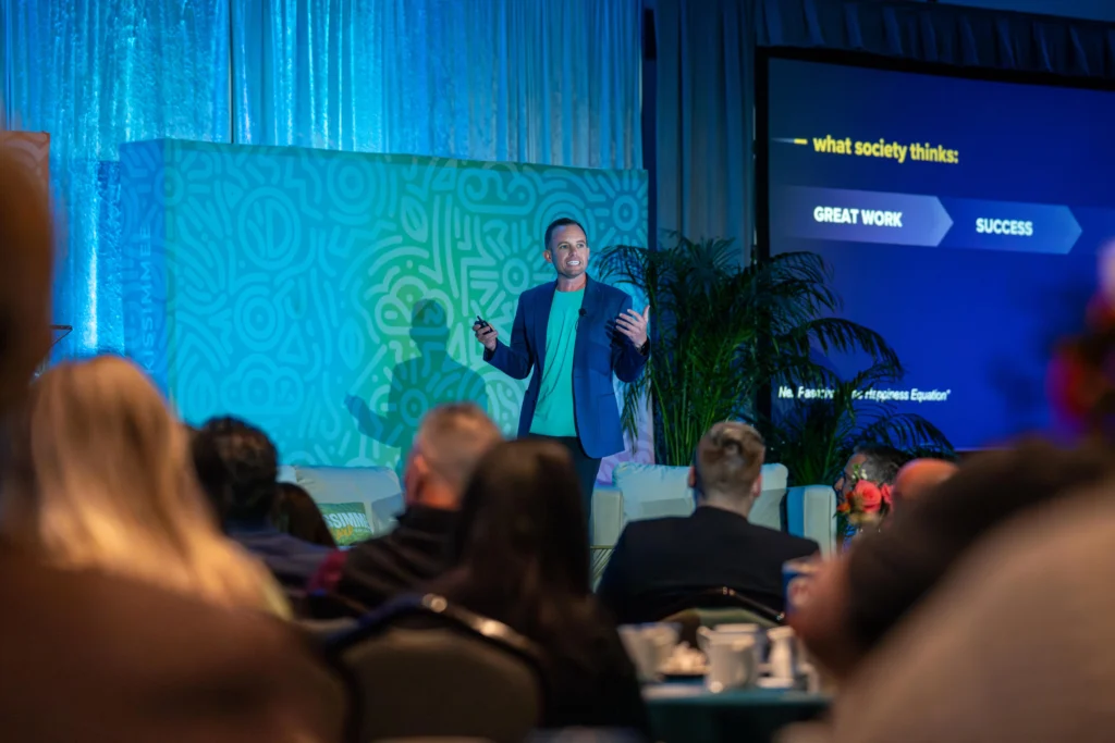 Nolan Nicholls on stage speaking