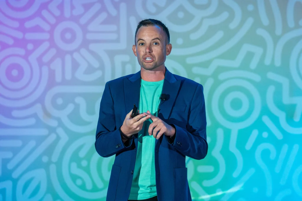 Nolan Nicholls on stage speaking